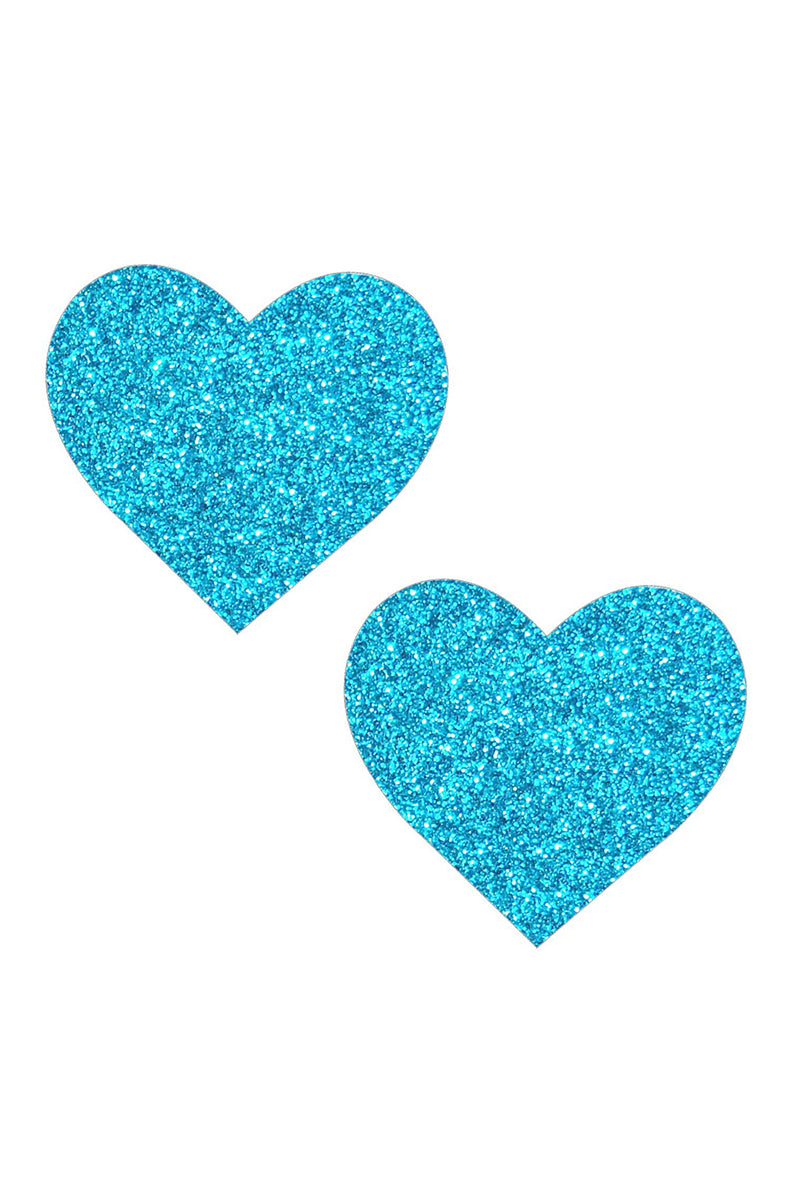 Two heart-shaped pasties cut from turquoise-blue glitter material.