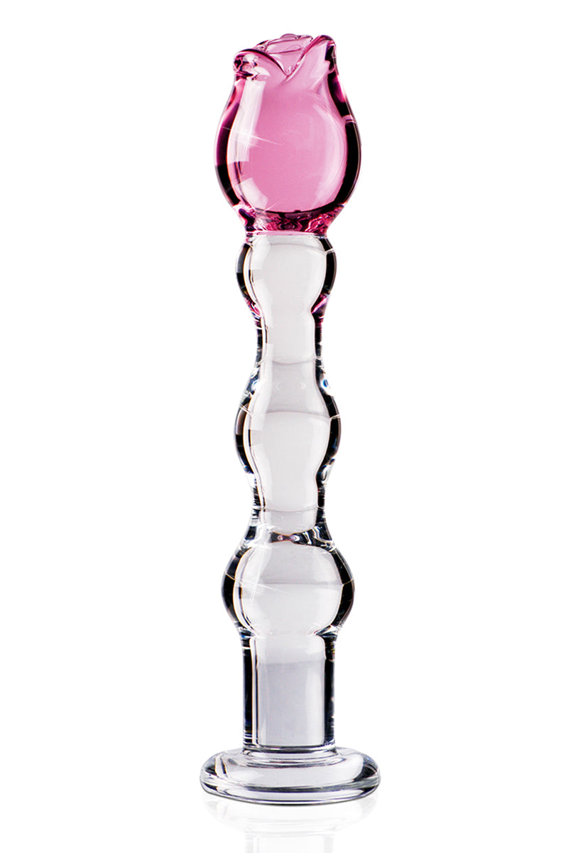 Hand-blown clear glass dildo with sculpted pink rose-bud tip and beaded bulbous shaft on a round flat glass base.