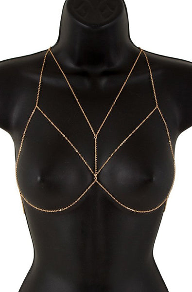 Plain gold-tone body chain bra with single-strand chains shaping open bra triangles, no rhinestone detail, on a black bust form.