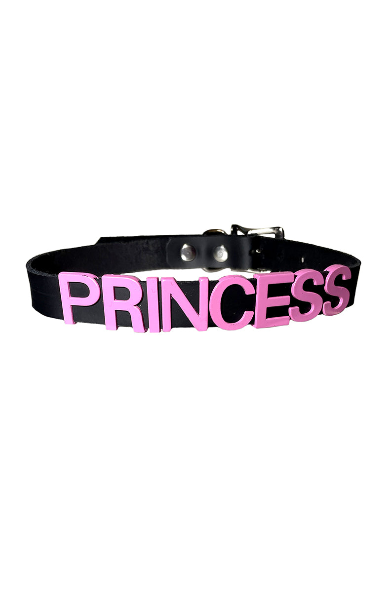 Black vegan-leather collar with "PRINCESS" in bold pink raised block lettering.
