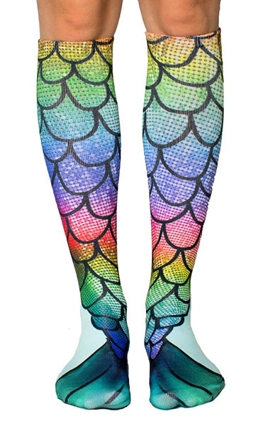 Knee-high socks with a rainbow mermaid-scale photo print and deep green fin tips at the cuff.