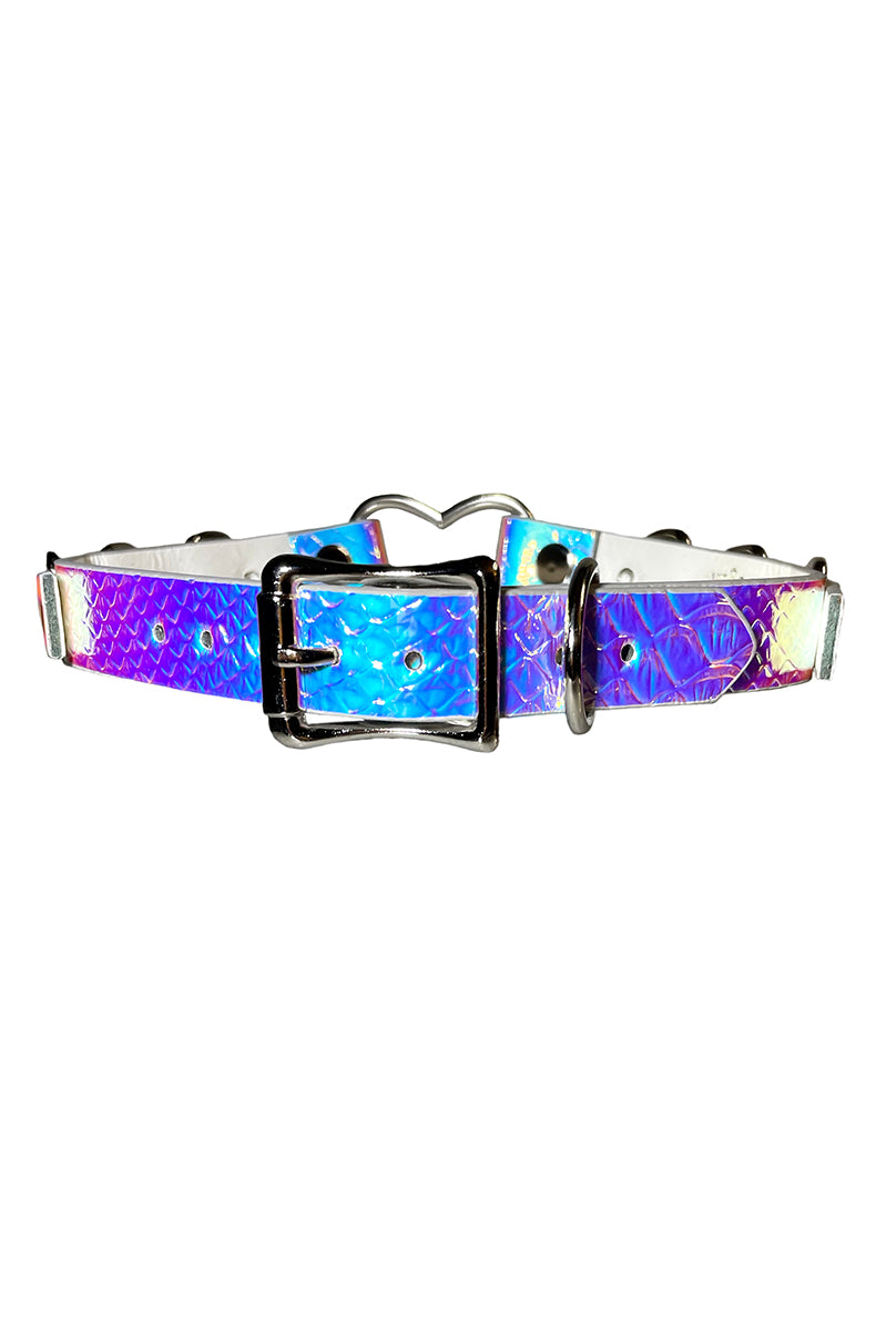 Holographic purple-pink-blue vegan leather collar with a silver heart-shaped opening ring at the front and multiple silver D-rings along the strap.