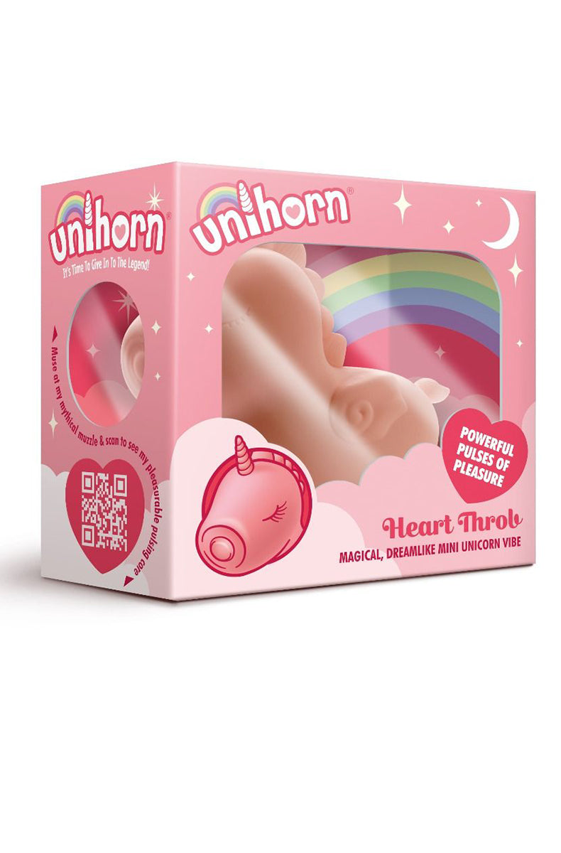 Open packaging of the Unihorn Heart Throb showing the pink silicone unicorn vibrator inside the rainbow box.