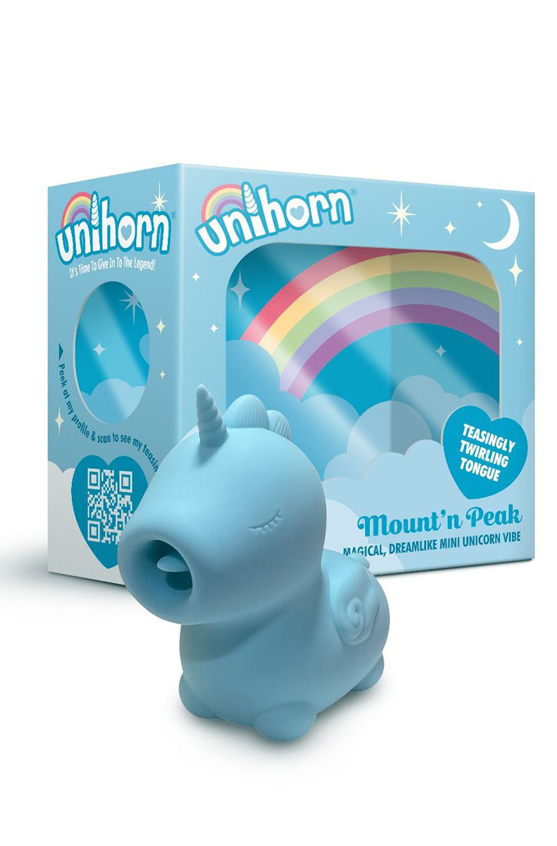 Open packaging of the Unihorn Mount n Peak showing the blue silicone unicorn vibrator inside the rainbow box.
